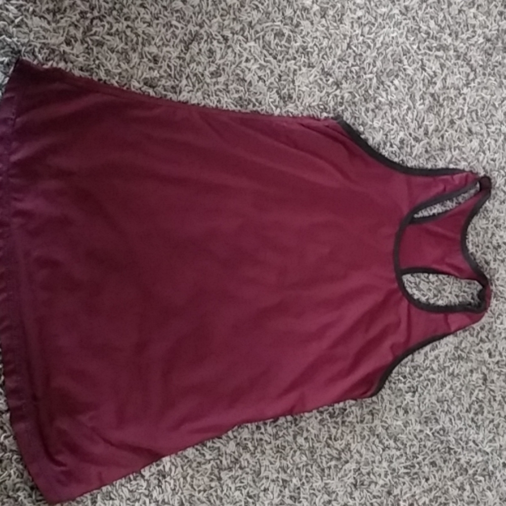 Maroon athletic shirt.